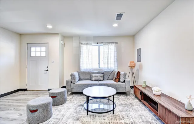 a living room with furniture and a window