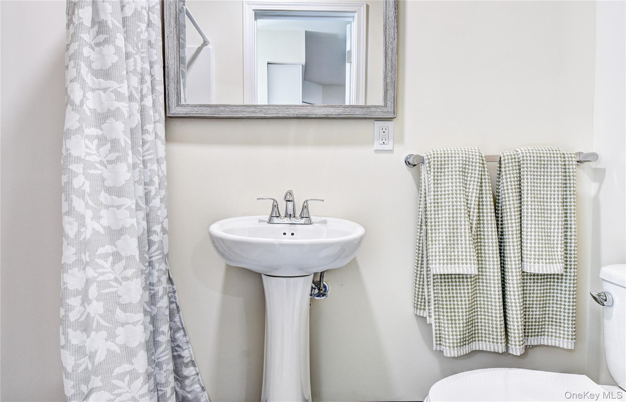 39 Levy Place Saugerties, NY 12477 - Photo 17 of 28 a bathroom with a sink toilet and mirror