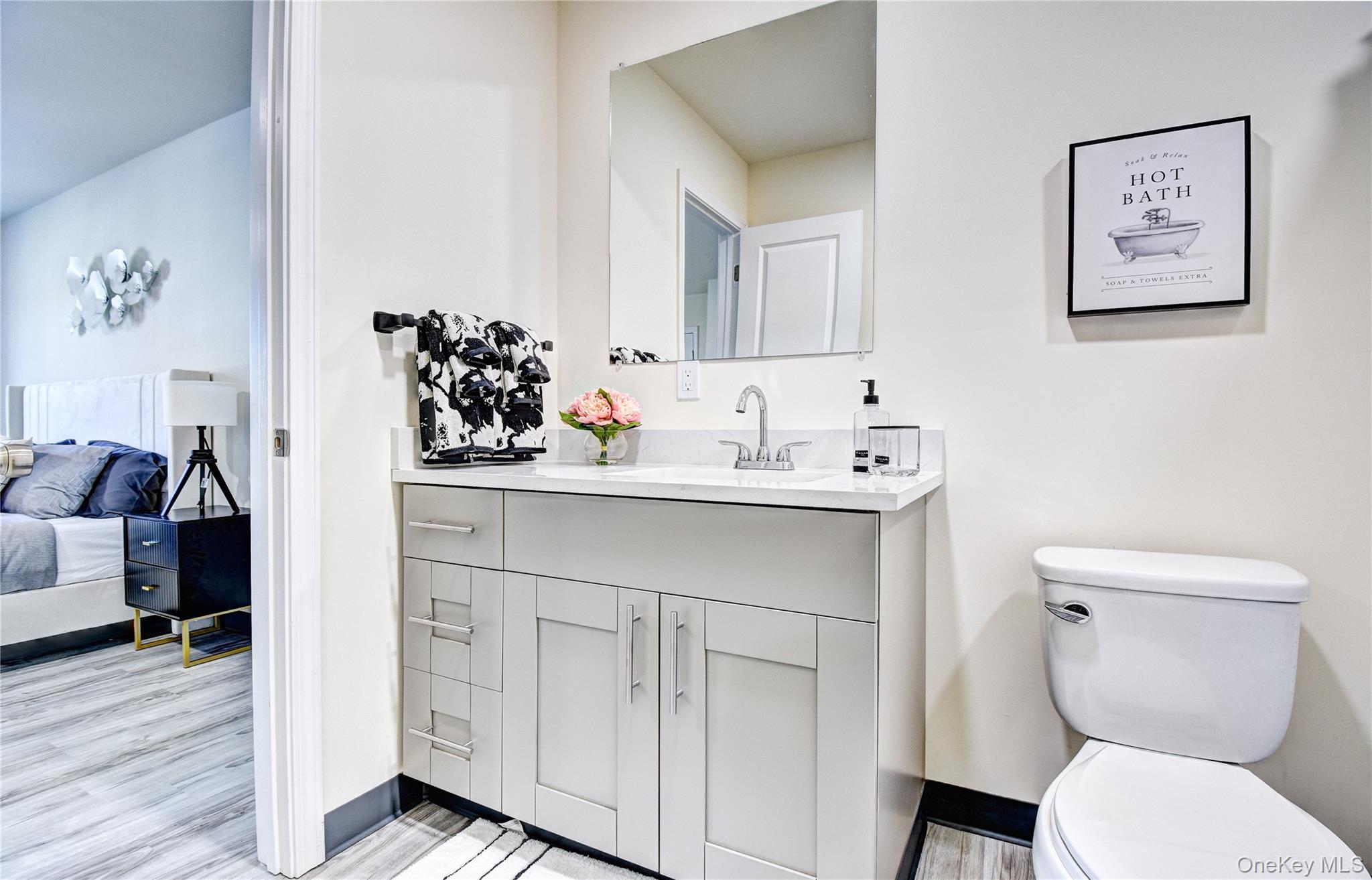 39 Levy Place Saugerties, NY 12477 - Photo 19 of 28 a bathroom with a toilet sink and mirror