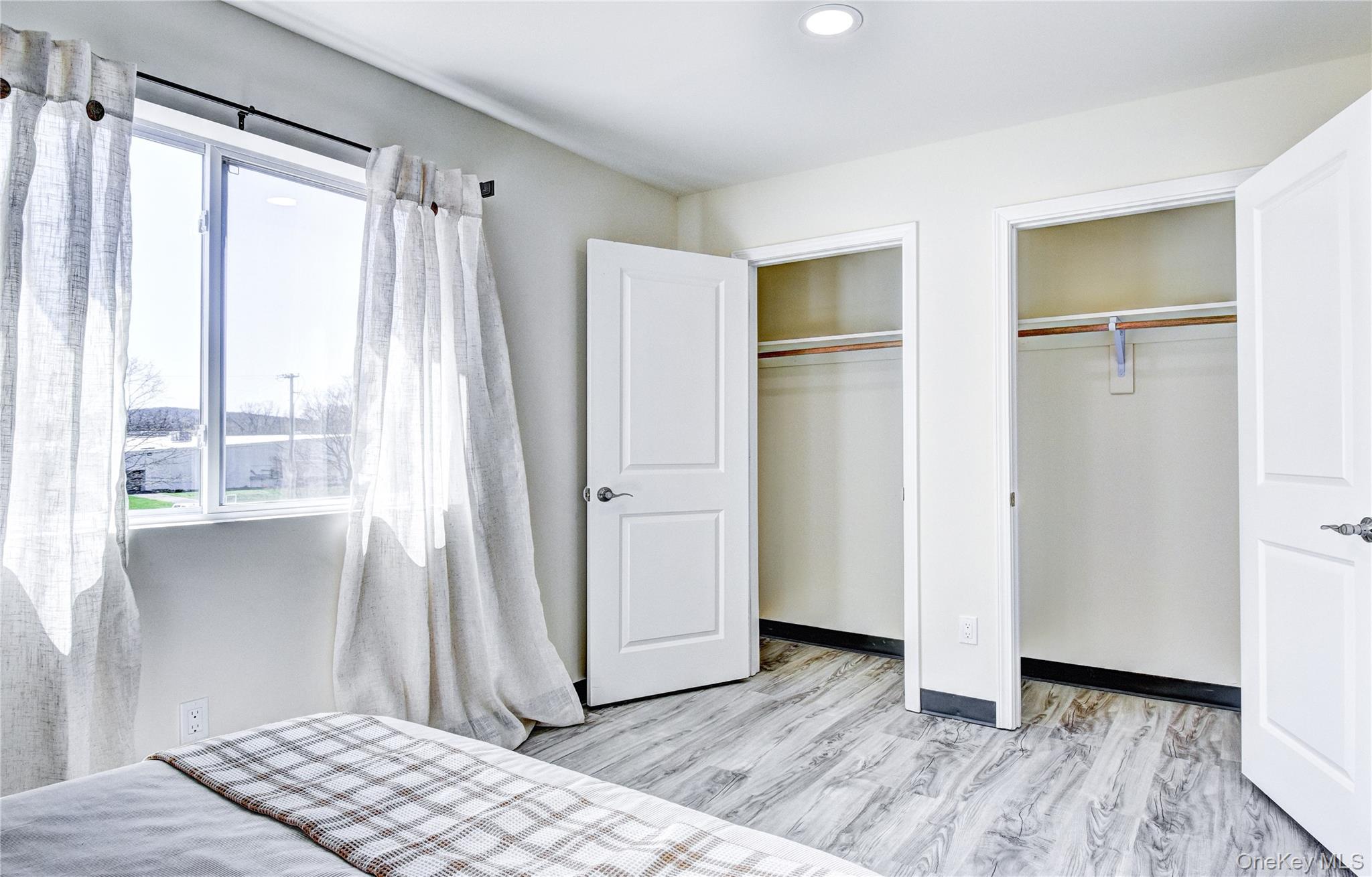 39 Levy Place Saugerties, NY 12477 - Photo 26 of 28 a view of empty room with wooden floor and fan