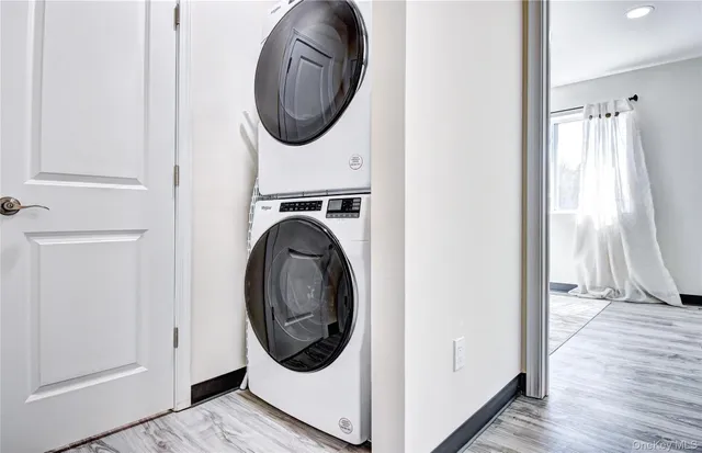 a view of a hallway with washer and dryer