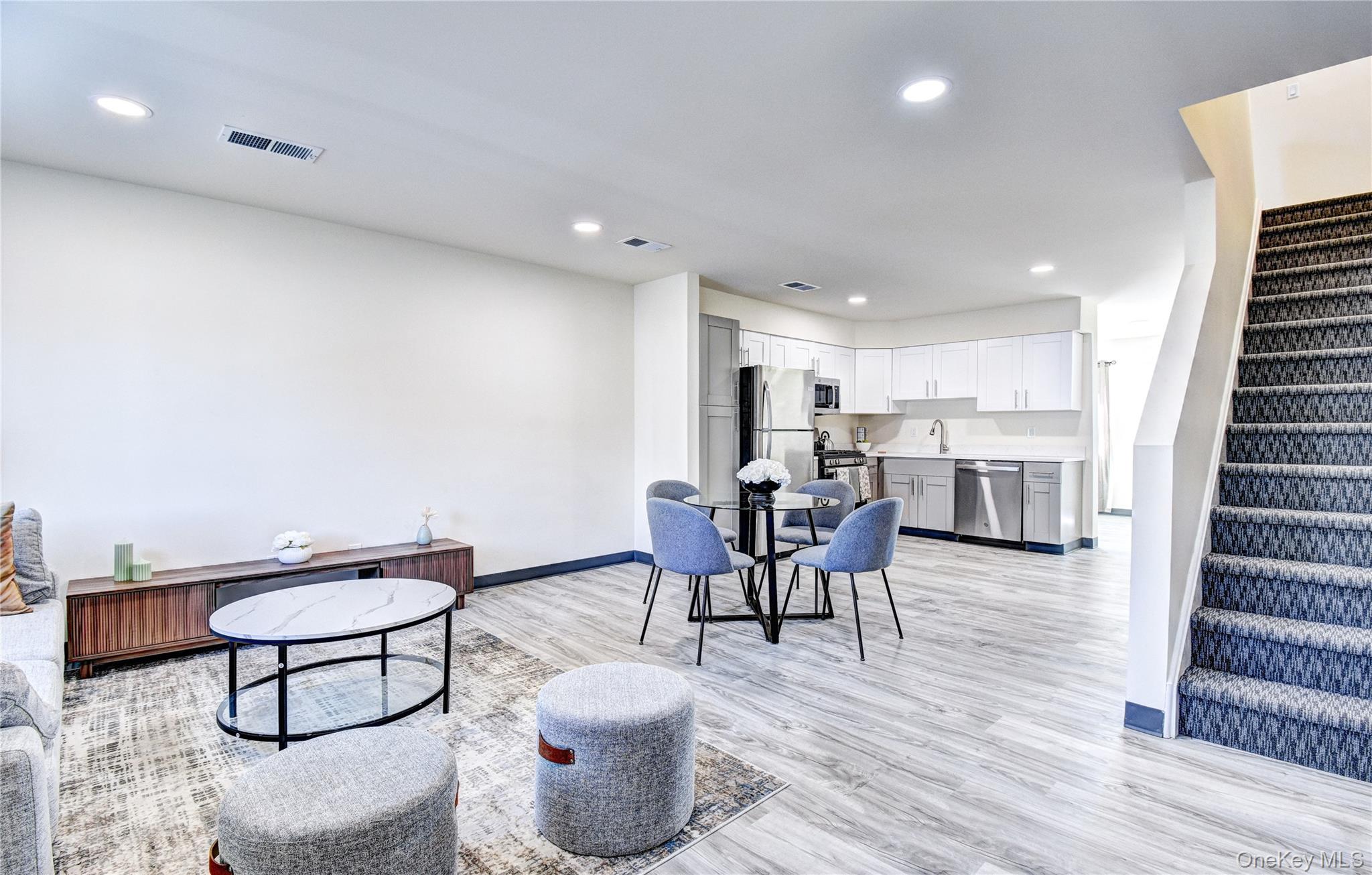 39 Levy Place Saugerties, NY 12477 - Photo 7 of 28 a living room with furniture a wooden floor and next to a window