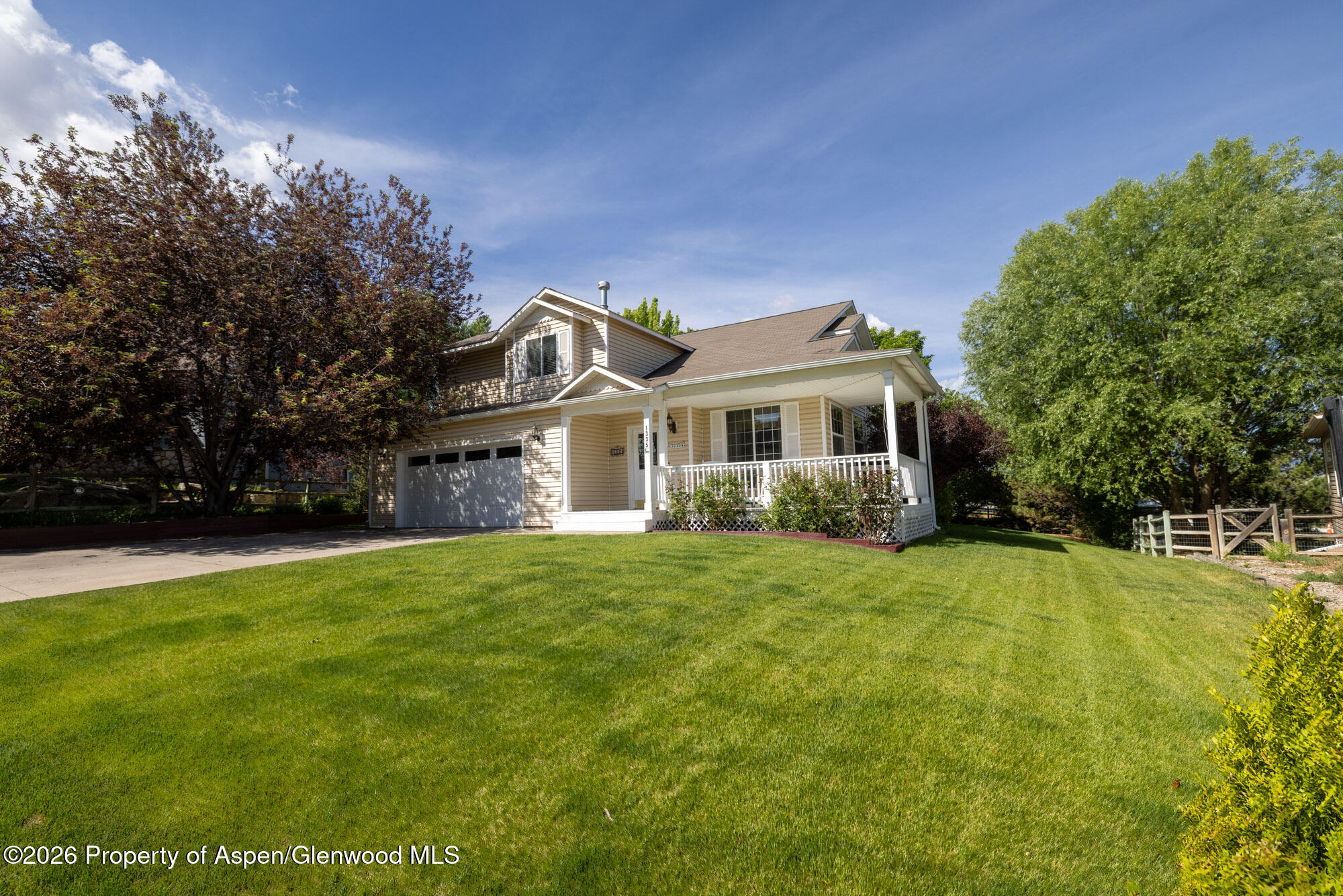 1335 Firethorn Drive Rifle, CO 81650 - Photo 1 of 30 a front view of a house with a garden