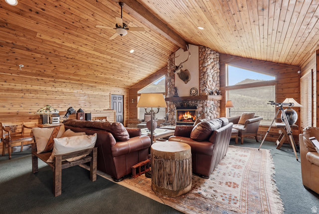 6 Beaver Springs Rancheros Oakley, UT 84055 - Photo 7 of 68 Expansive living area featuring a vaulted wood-paneled ceiling, a stone fireplace, and large triangular windows