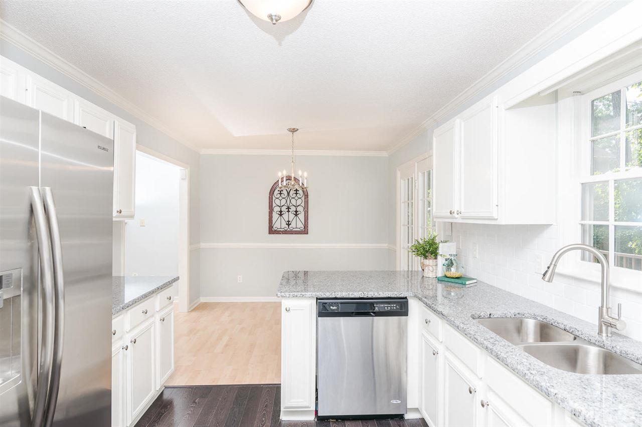 308 Crosspine Drive Raleigh, NC 27603 - Photo 5 of 11 Kitchen opens up to spacious dining area.