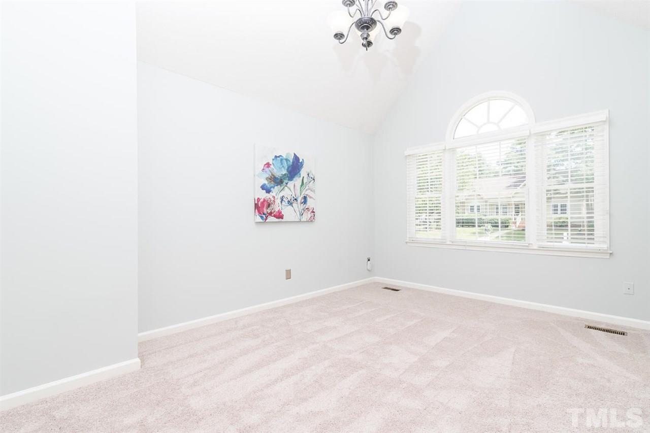 308 Crosspine Drive Raleigh, NC 27603 - Photo 6 of 11 Master bedroom boasts cathedral ceilings, steaming light and brand new carpet.