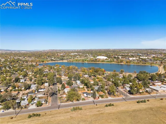 an aerial view of residential building and ocean