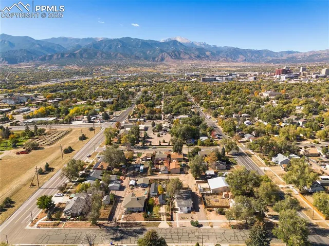 an aerial view of residential house and green space