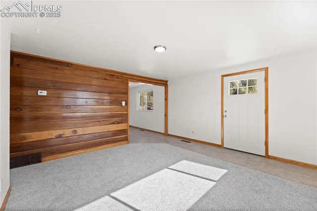 a view of room with stairs and a cabinet