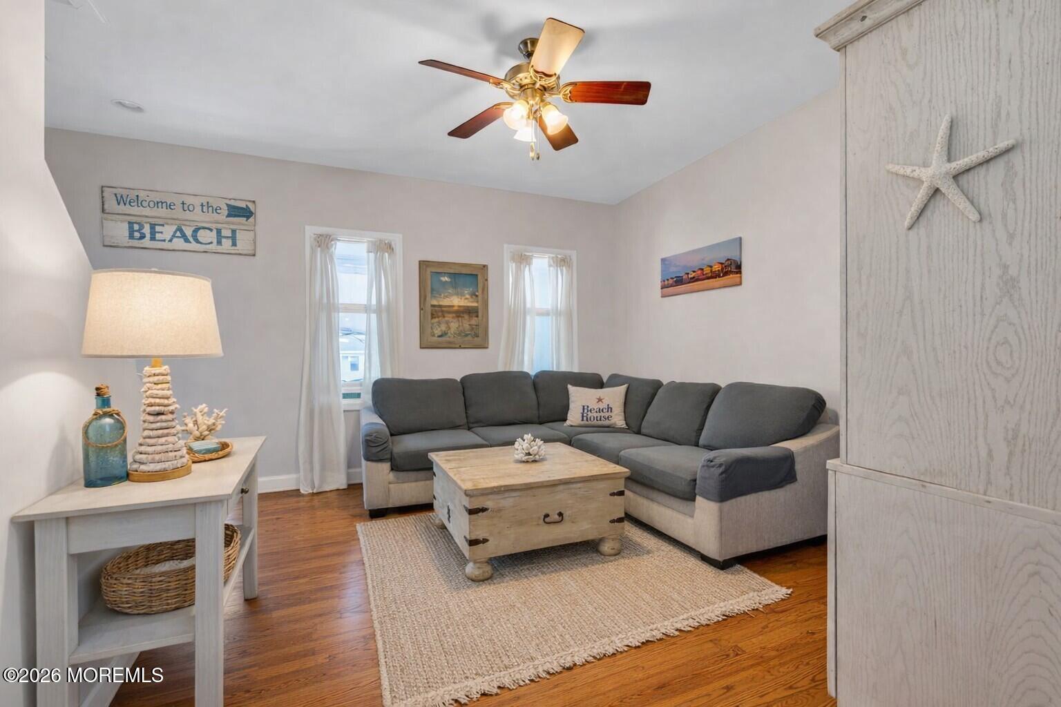6 Beach Street Sea Bright, NJ 07760 - Photo 5 of 31 a living room with furniture and a lamp