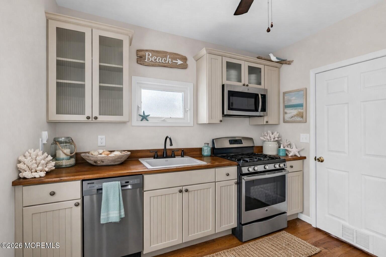 6 Beach Street Sea Bright, NJ 07760 - Photo 10 of 31 a kitchen with stainless steel appliances granite countertop a stove and a microwave