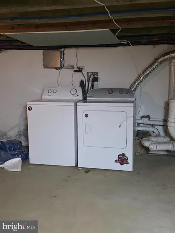 a utility room with a washing machine
