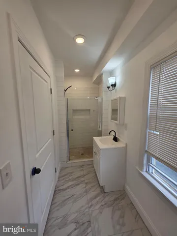 a bathroom with a bathtub and shower