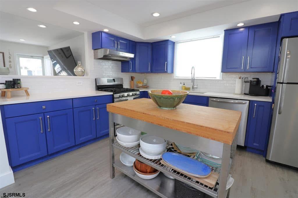 4 North Decatur Avenue Margate City, NJ 08402 - Photo 2 of 28 a kitchen with stainless steel appliances a stove a sink and a microwave