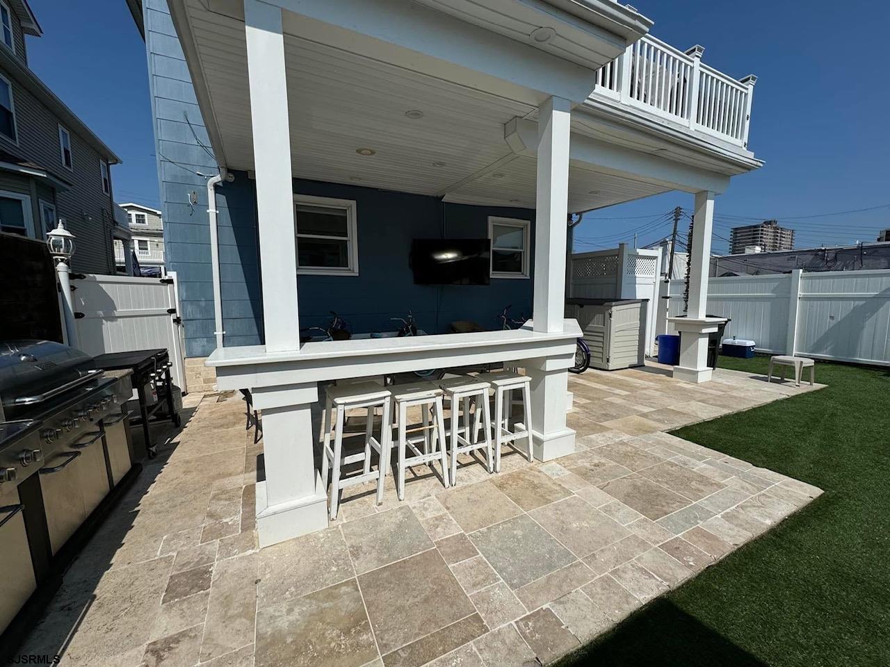 4 North Decatur Avenue Margate City, NJ 08402 - Photo 23 of 28 a view of a dinning table and chairs in the patio