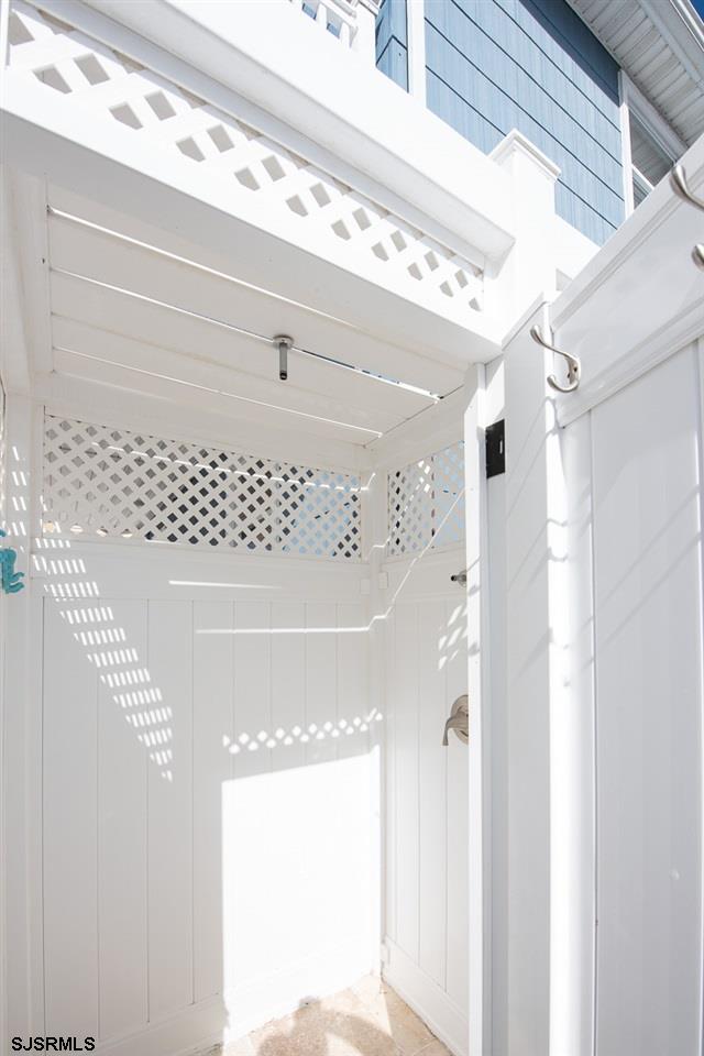 4 North Decatur Avenue Margate City, NJ 08402 - Photo 24 of 28 a bathroom with a mirror and a shower