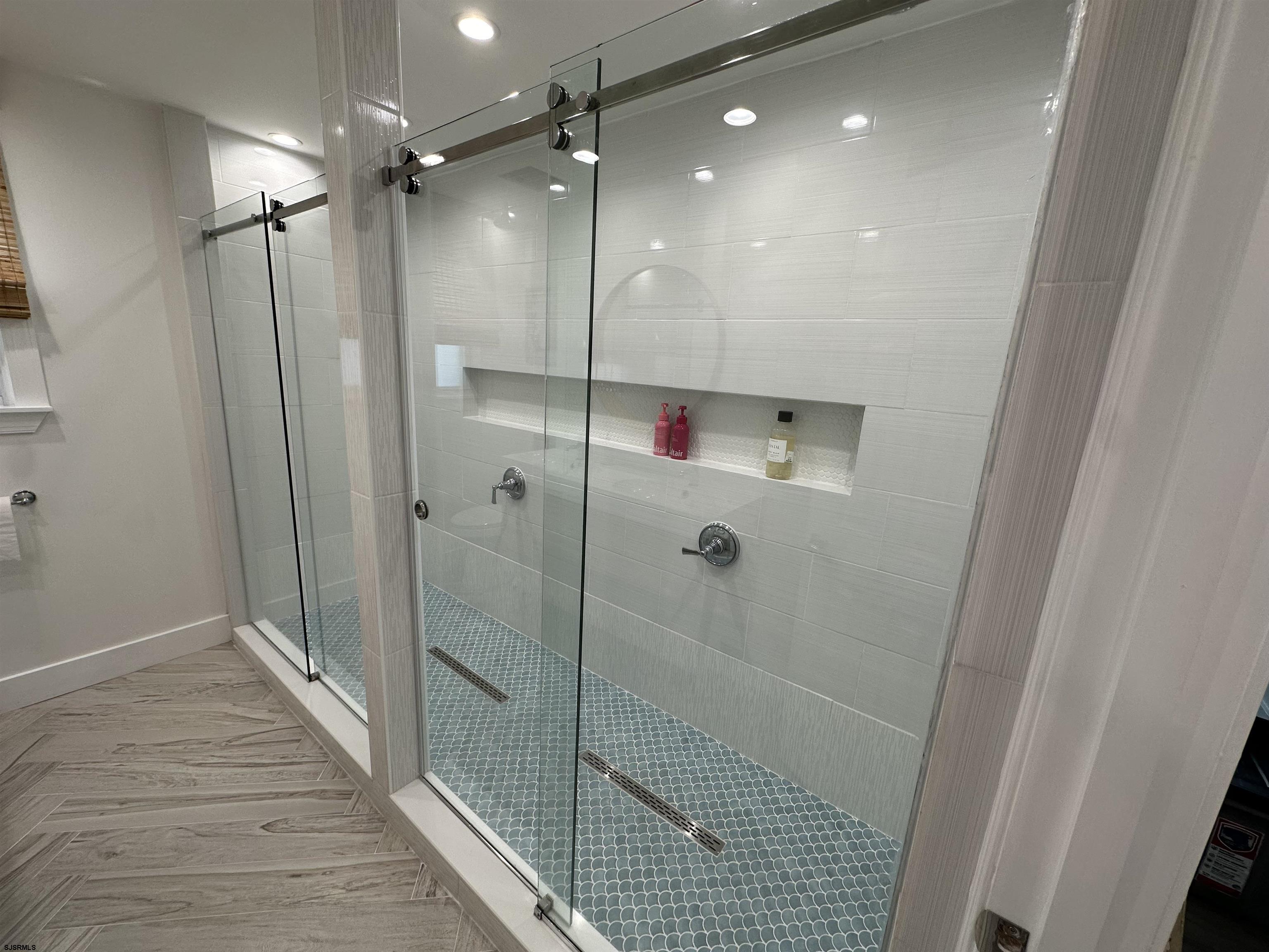 4 North Decatur Avenue Margate City, NJ 08402 - Photo 6 of 28 a bathroom with a shower and a glass door