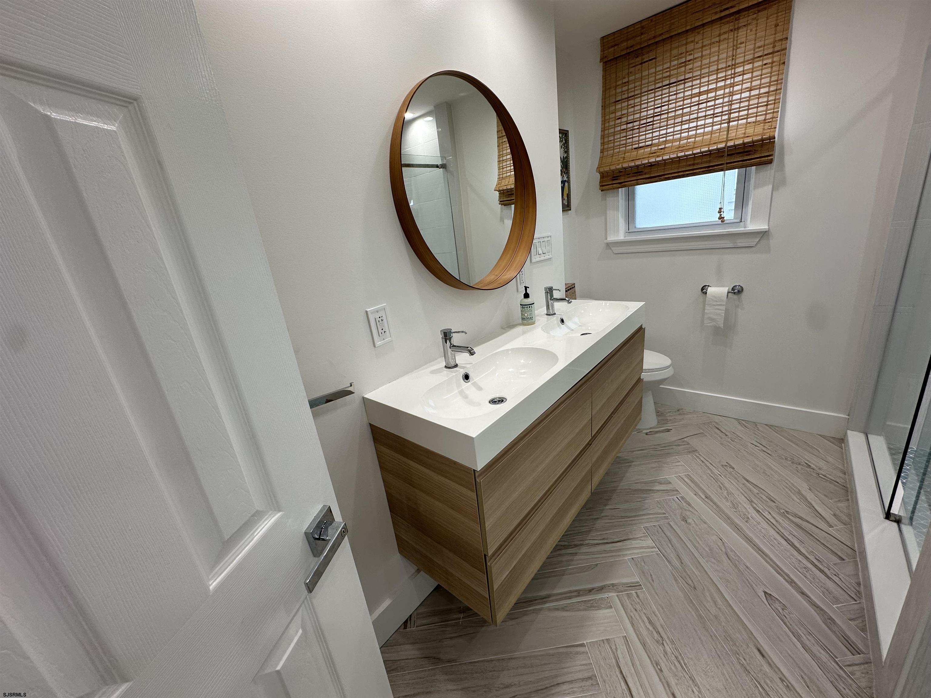 4 North Decatur Avenue Margate City, NJ 08402 - Photo 7 of 28 a bathroom with a sink and a mirror