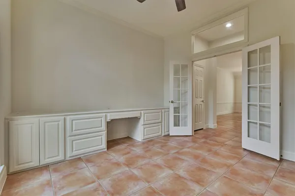 a view of an empty room with a bathroom