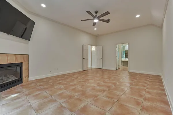 a view of an empty room with a fireplace