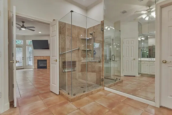 a bathroom with a shower and a sink