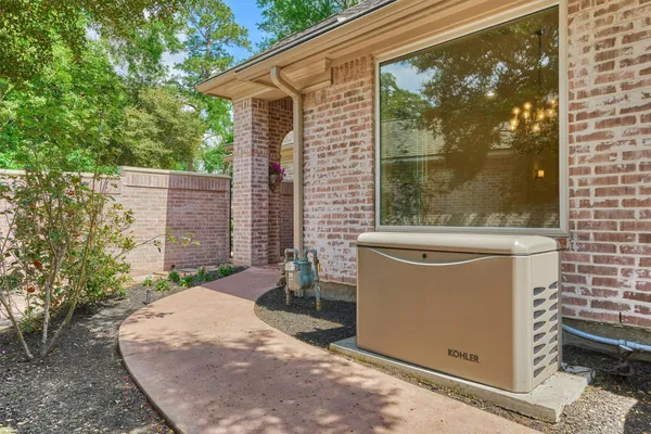 a backyard of a house with a fountain