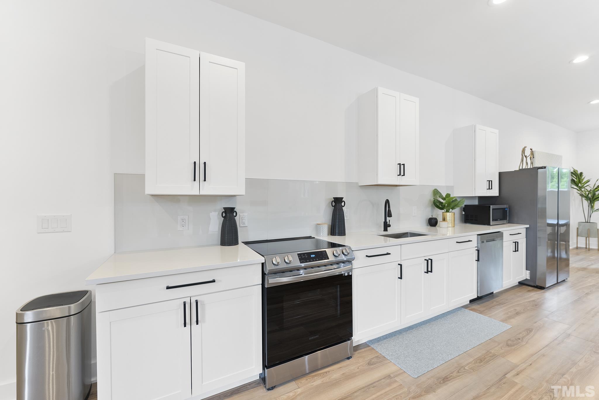 1920 Cook Road Durham, NC 27713 - Photo 14 of 43 a kitchen with cabinets appliances a sink and a counter space