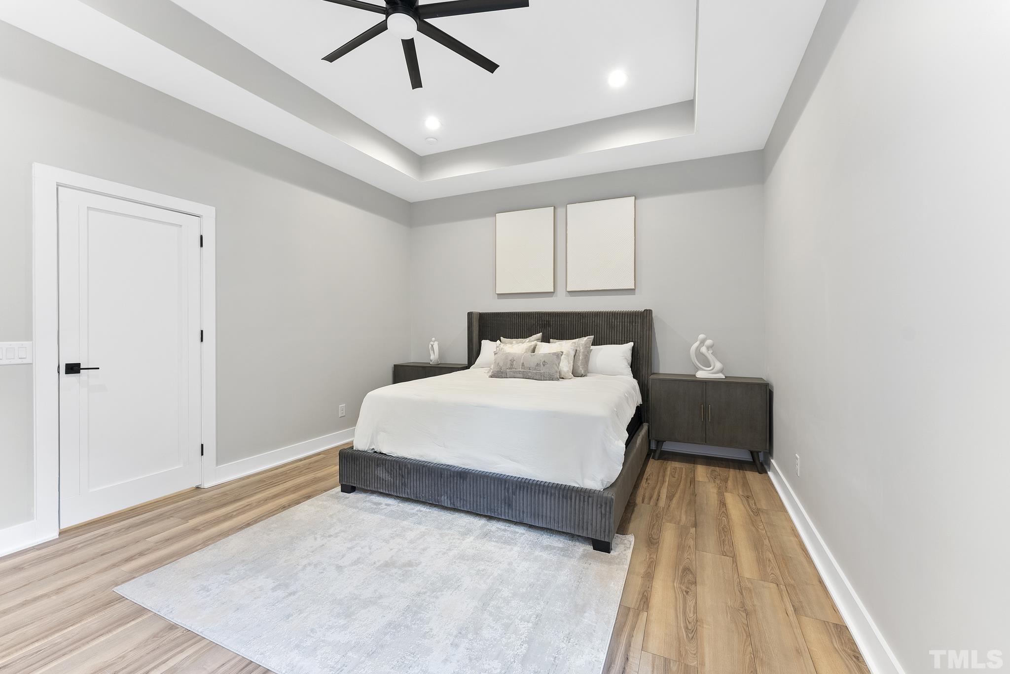 1920 Cook Road Durham, NC 27713 - Photo 17 of 43 a bedroom with a bed and wooden floor