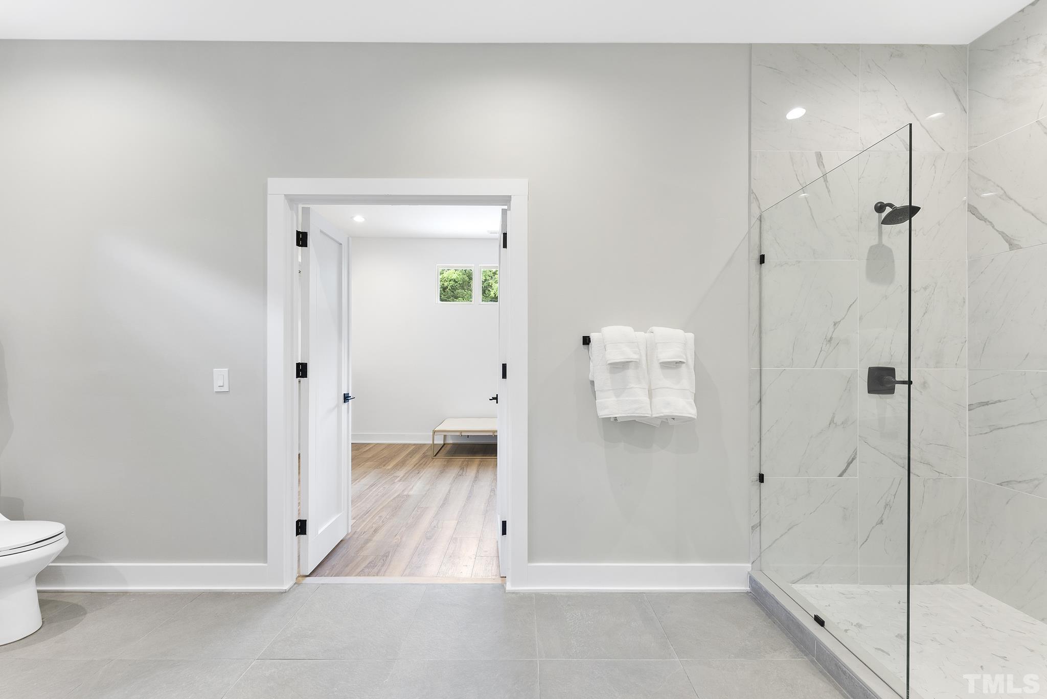1920 Cook Road Durham, NC 27713 - Photo 18 of 43 a bathroom with a shower and toilet