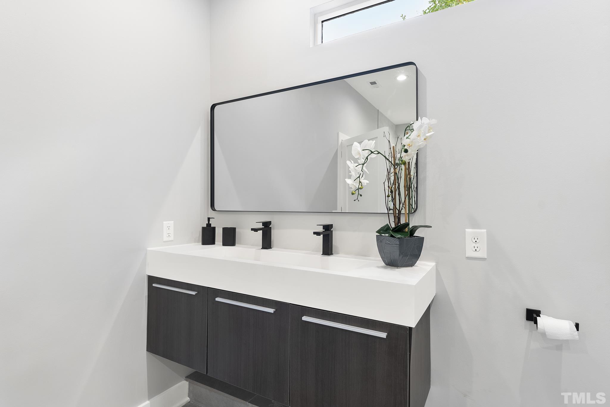 1920 Cook Road Durham, NC 27713 - Photo 20 of 43 a bathroom with a sink and a mirror