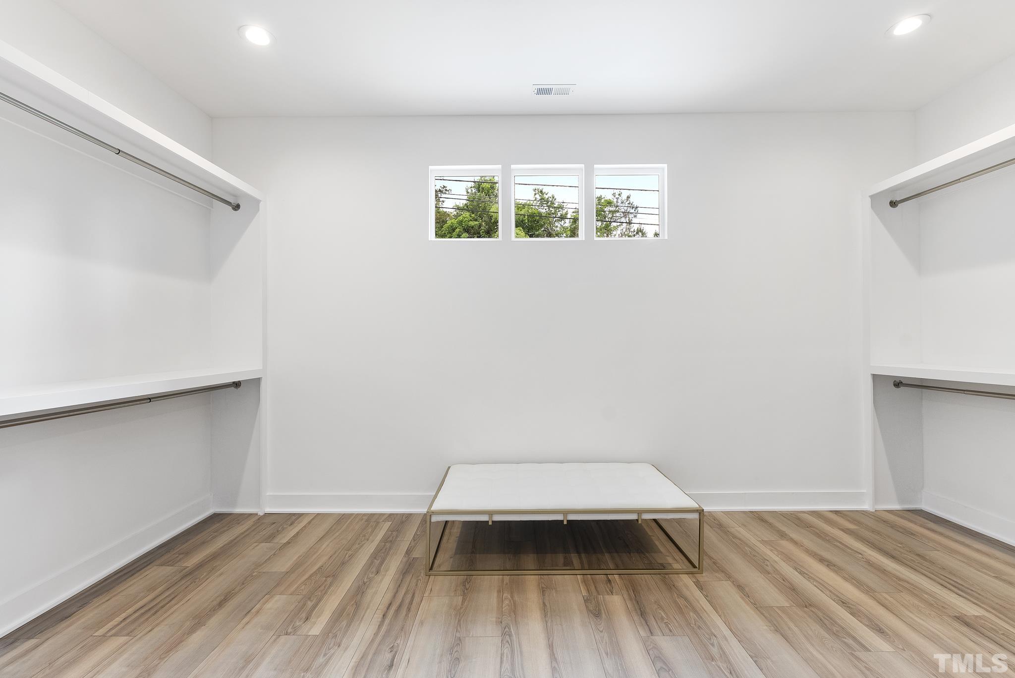 1920 Cook Road Durham, NC 27713 - Photo 22 of 43 an empty room with wooden floor and windows