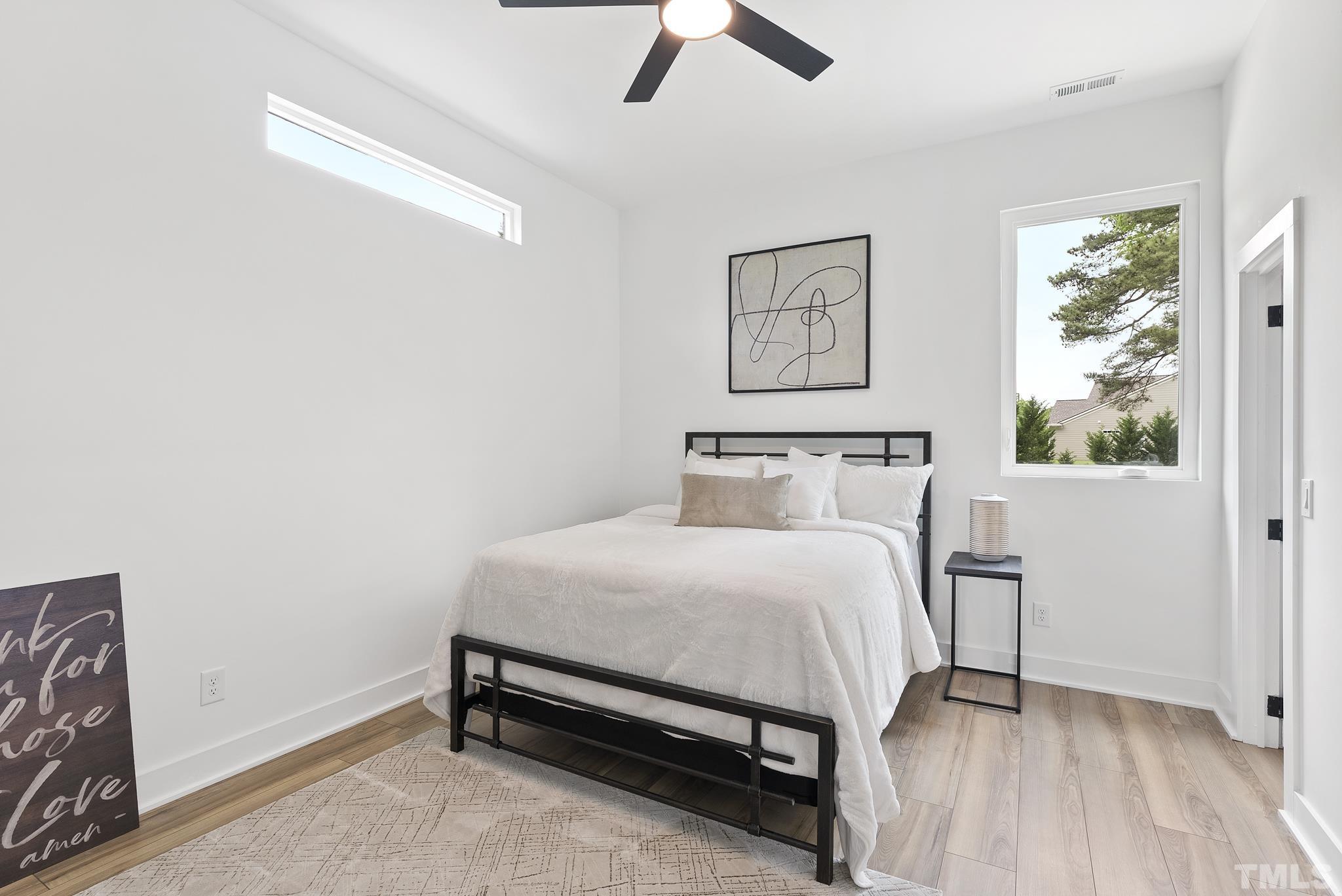 1920 Cook Road Durham, NC 27713 - Photo 28 of 43 a bedroom with a bed and a window