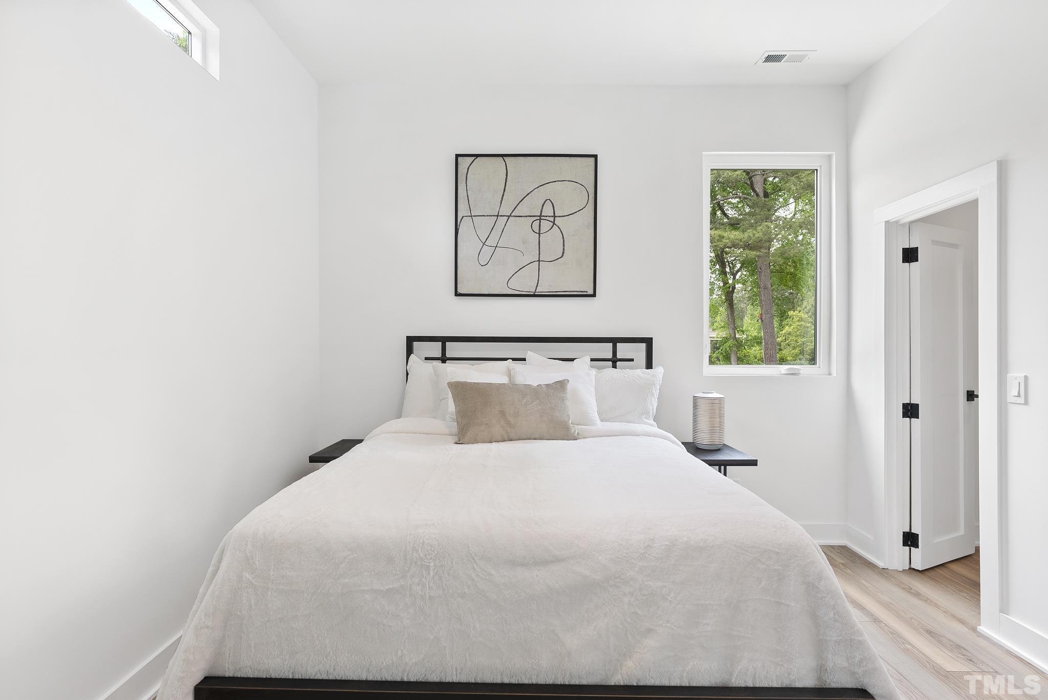 1920 Cook Road Durham, NC 27713 - Photo 29 of 43 a bedroom with a bed and a window