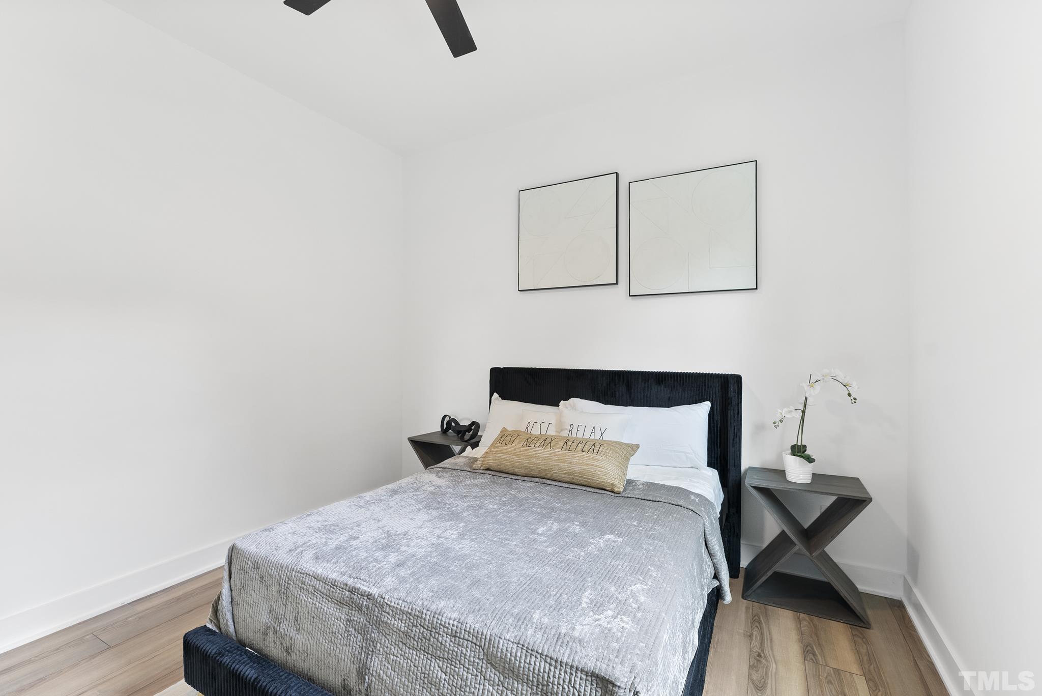 1920 Cook Road Durham, NC 27713 - Photo 32 of 43 a bedroom with a bed and wooden floor