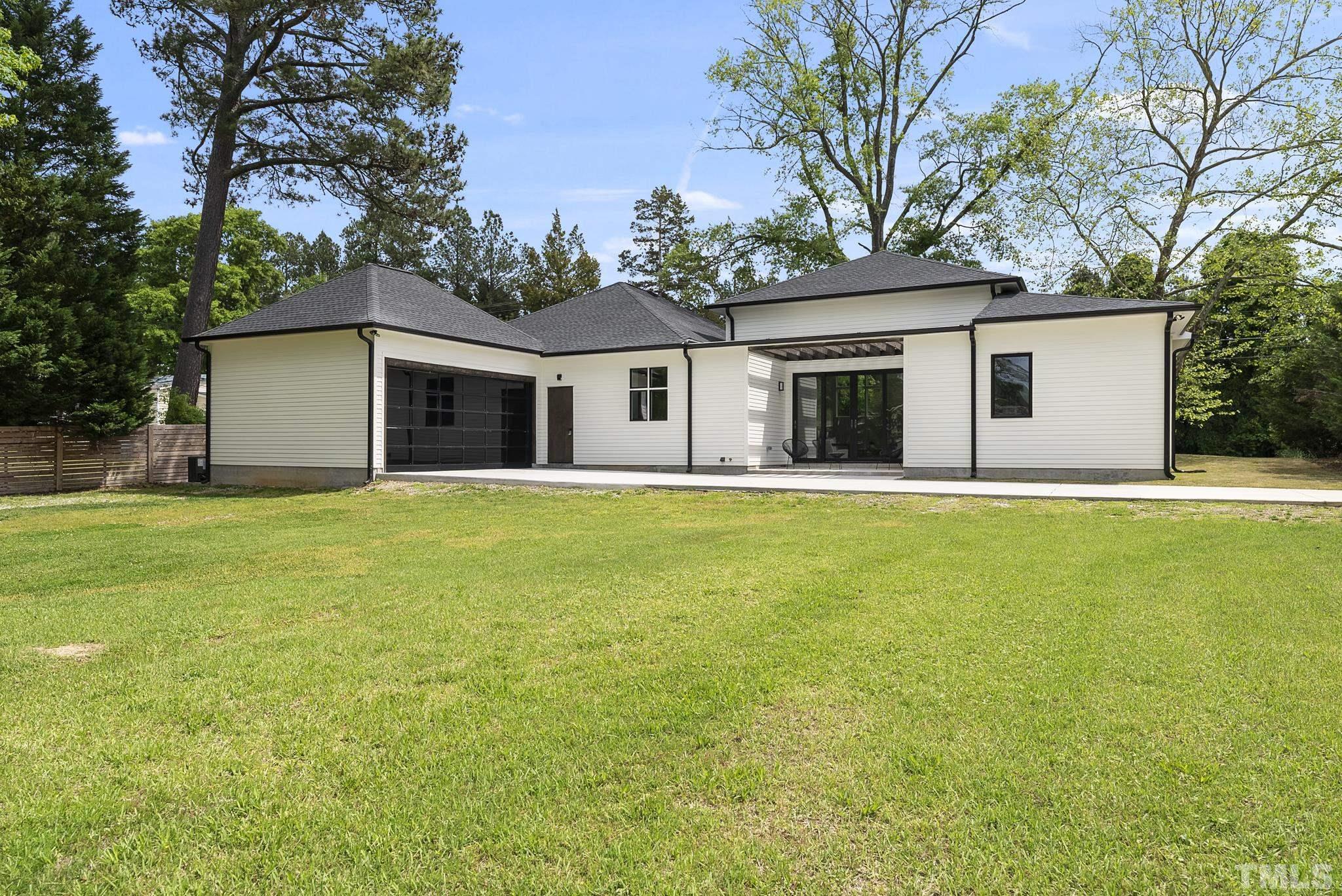 1920 Cook Road Durham, NC 27713 - Photo 36 of 43 a front view of house with yard and trees in the background