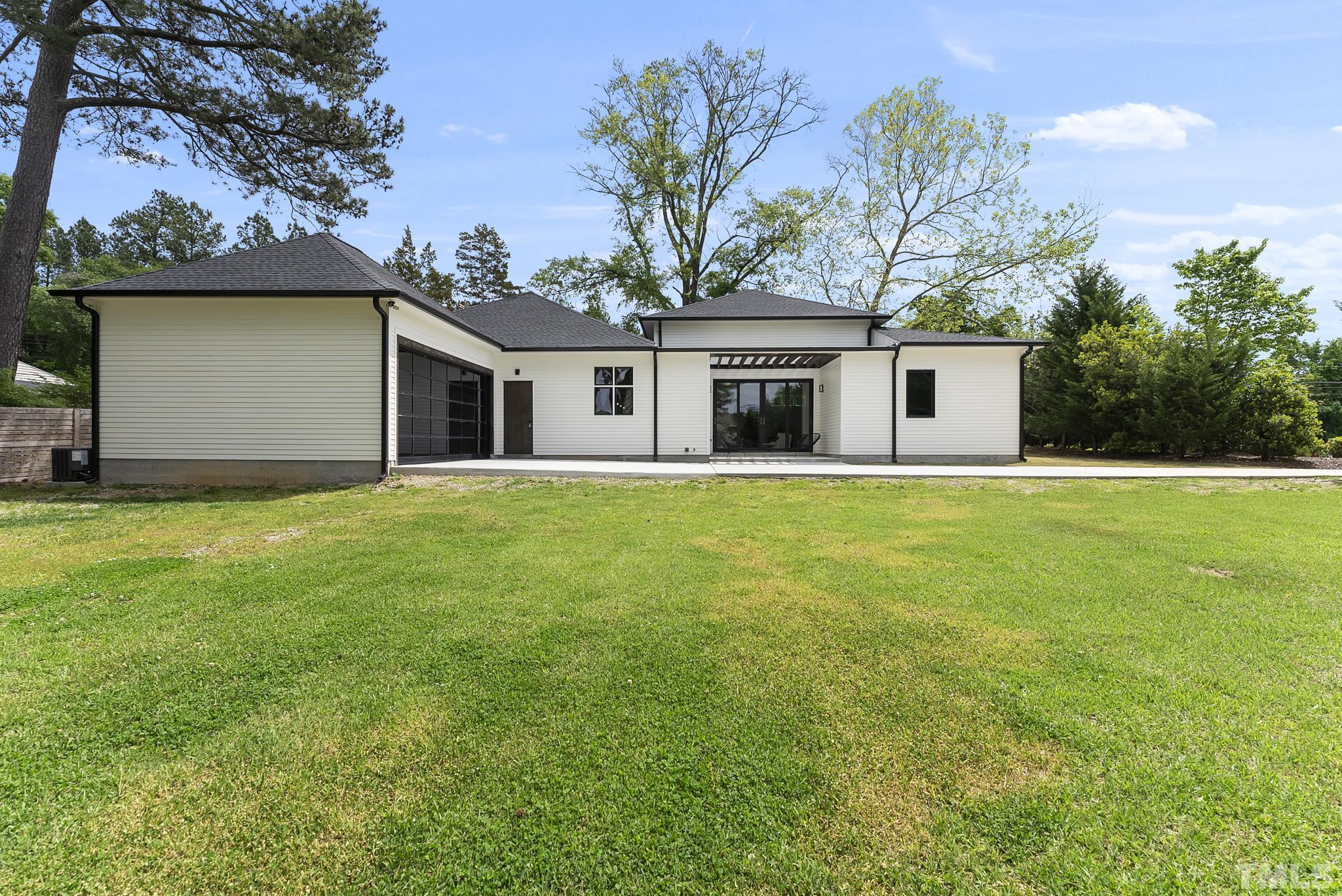 1920 Cook Road Durham, NC 27713 - Photo 39 of 43 a front view of house with yard and trees in the background