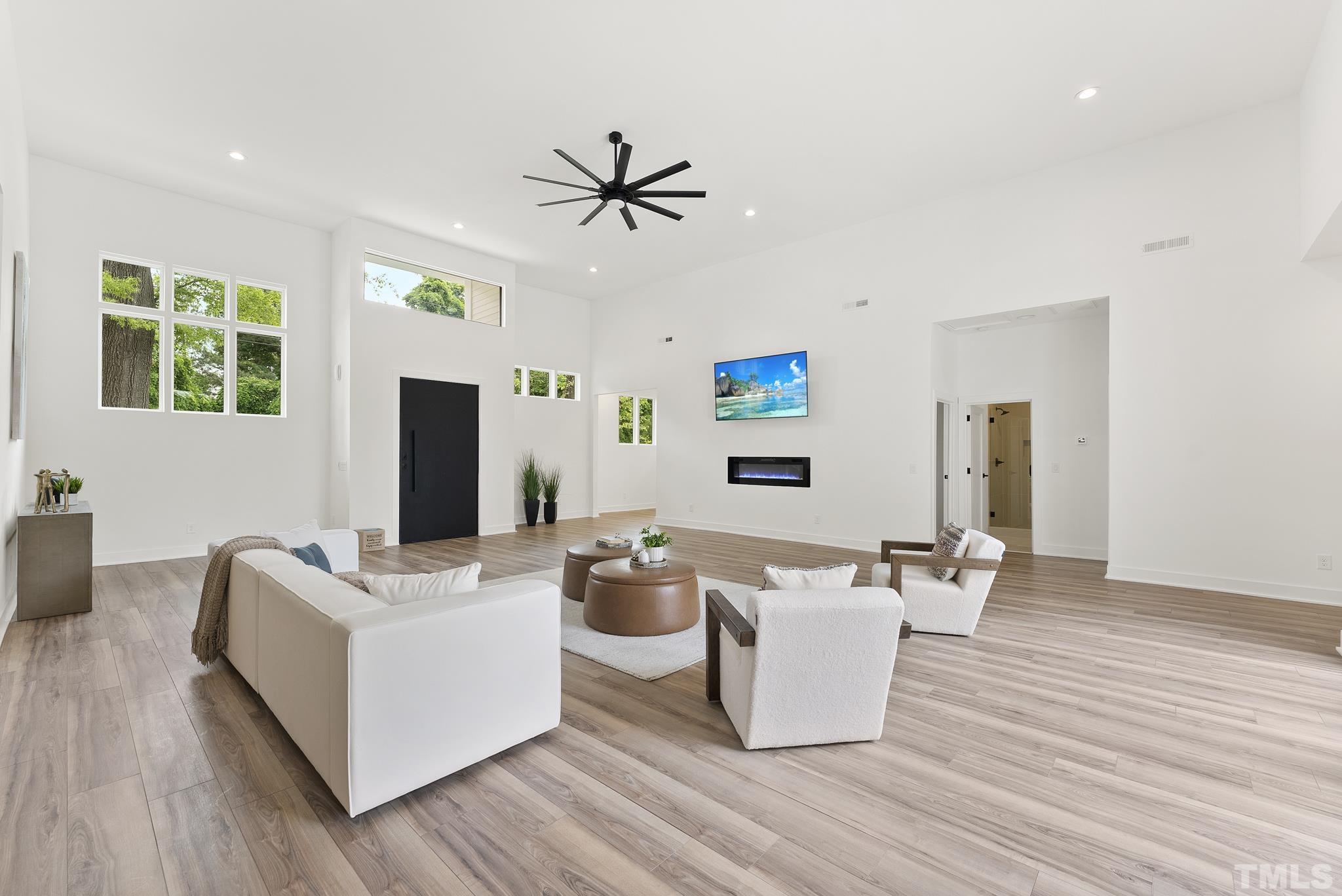 1920 Cook Road Durham, NC 27713 - Photo 5 of 43 a living room with furniture a flat screen tv and a wooden floor