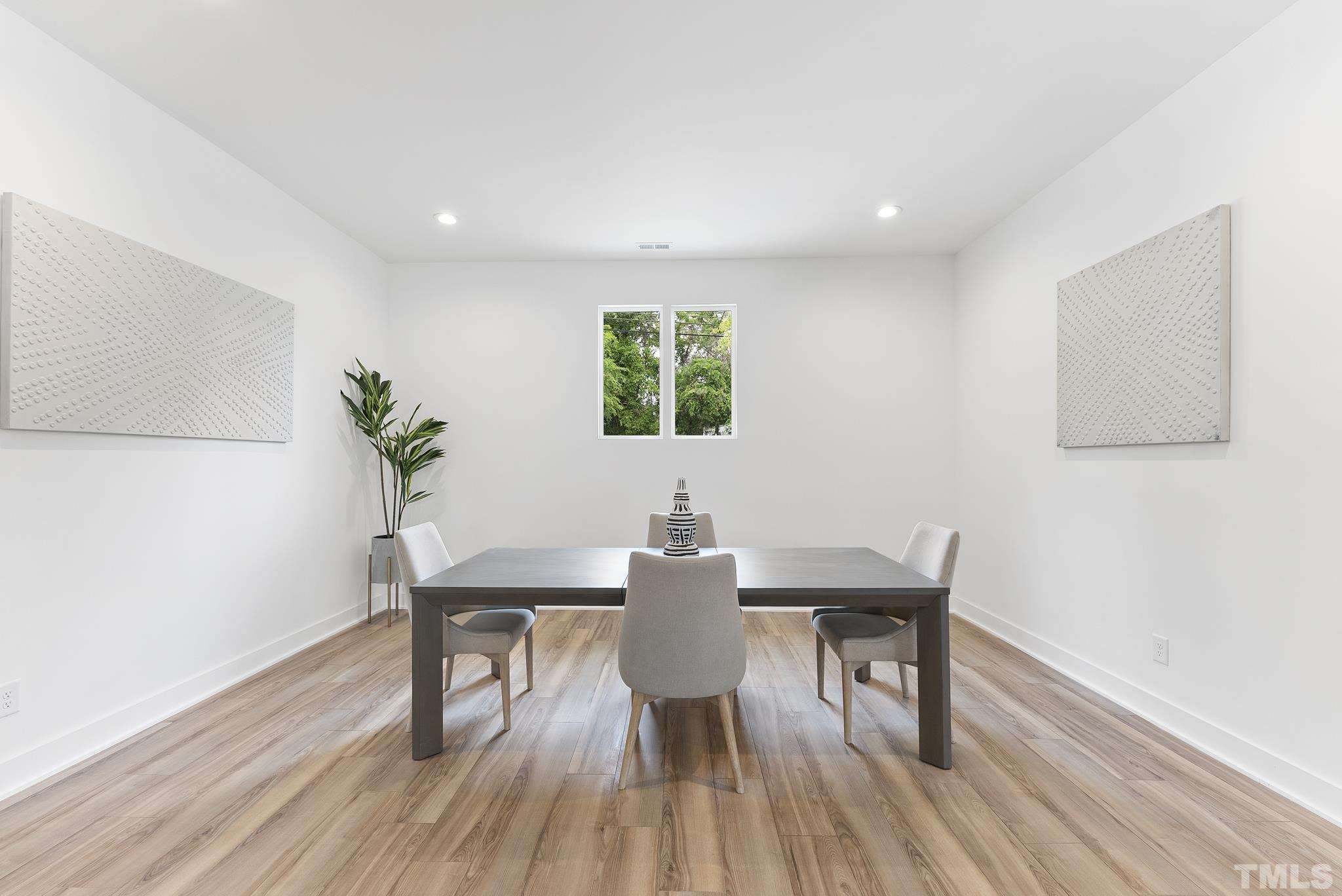 1920 Cook Road Durham, NC 27713 - Photo 9 of 43 a view of a dining room with furniture window and wooden floor