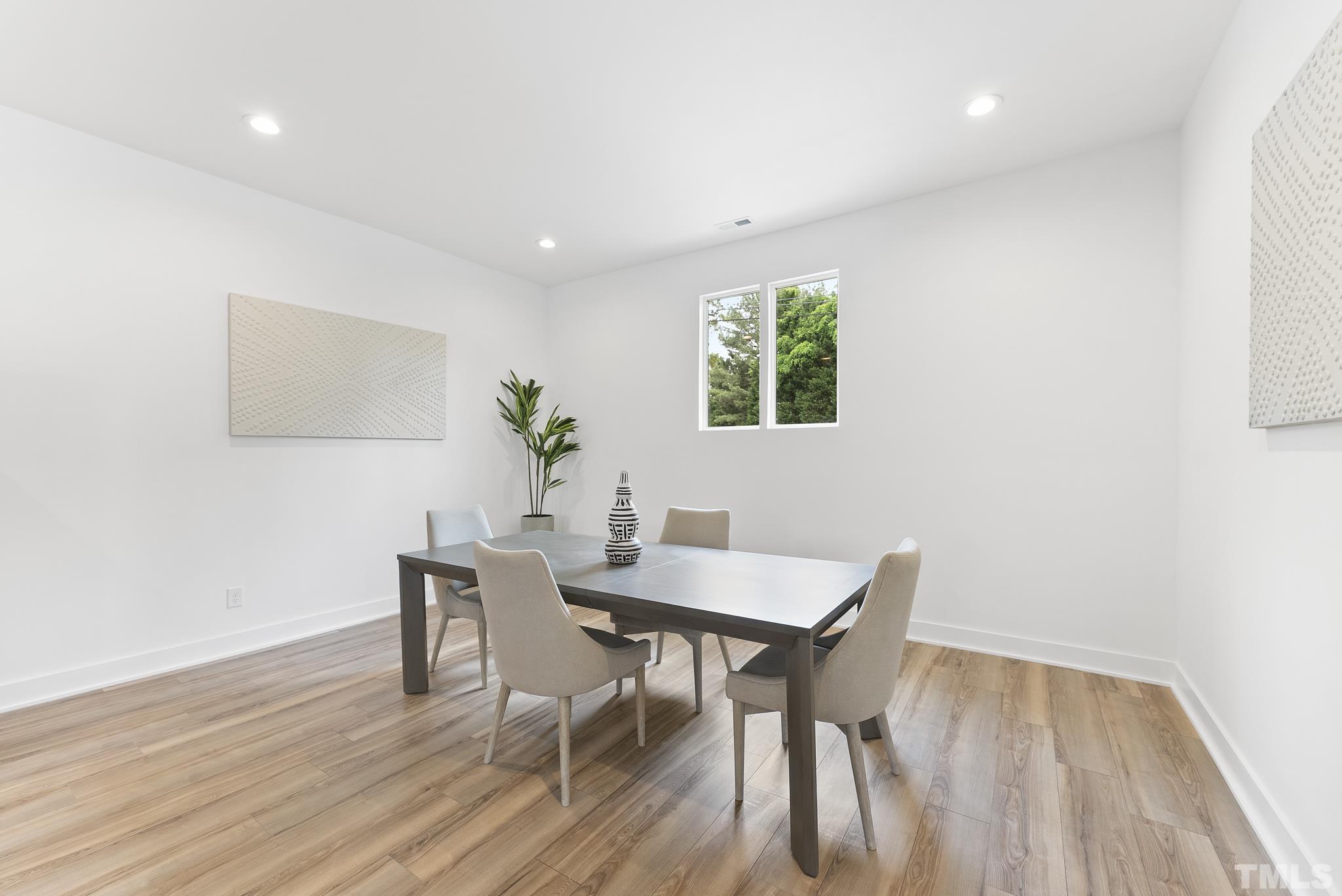 1920 Cook Road Durham, NC 27713 - Photo 10 of 43 a view of a dining room with furniture and wooden floor