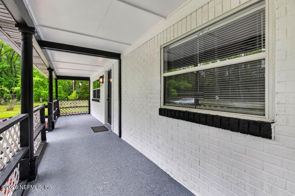 43739 Ratliff Road Callahan, FL 32011 - Photo 11 of 55 a view of a porch of a house