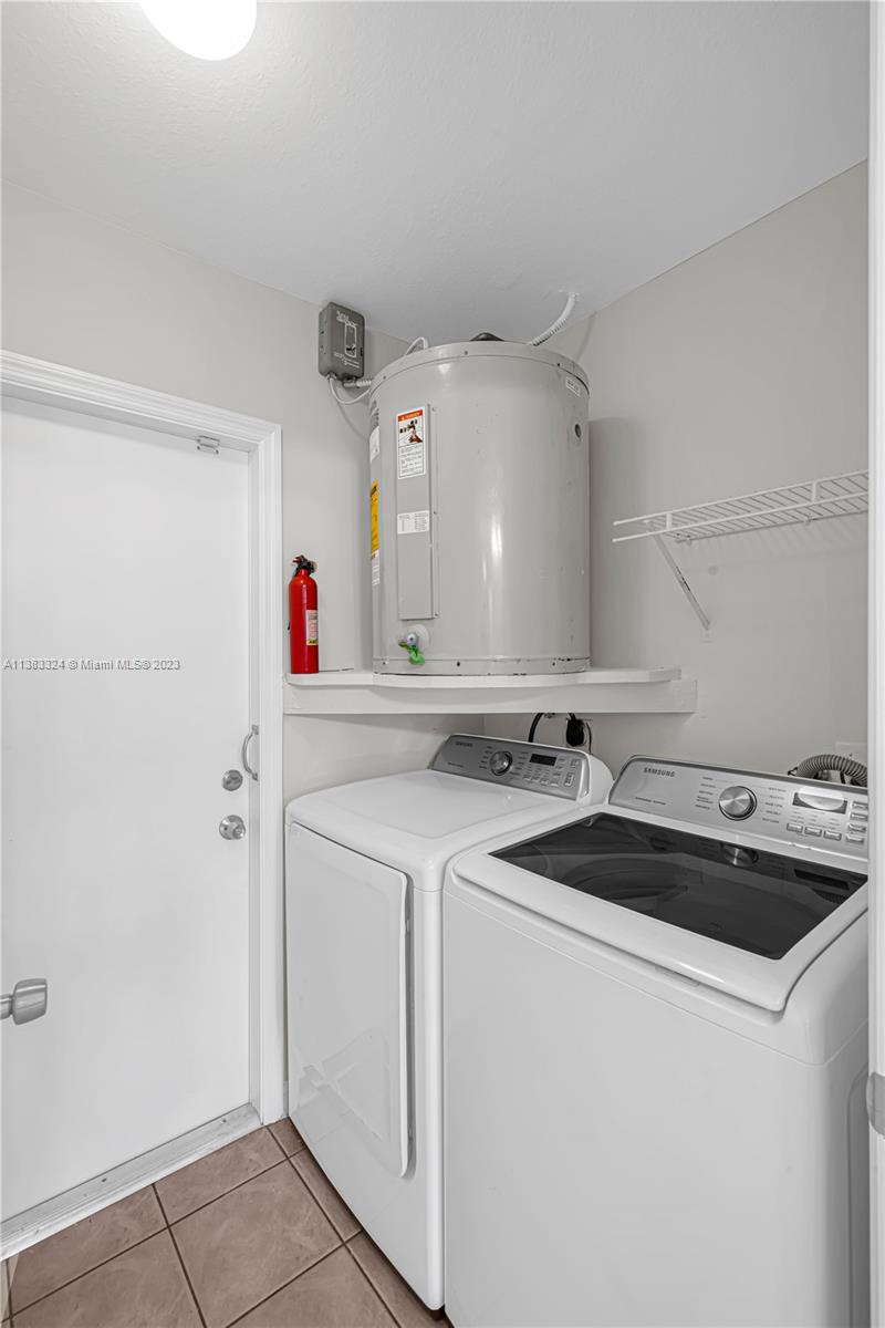 14809 Southwest 180th Street Miami, FL 33187 - Photo 18 of 38 a utility room with dryer and washer