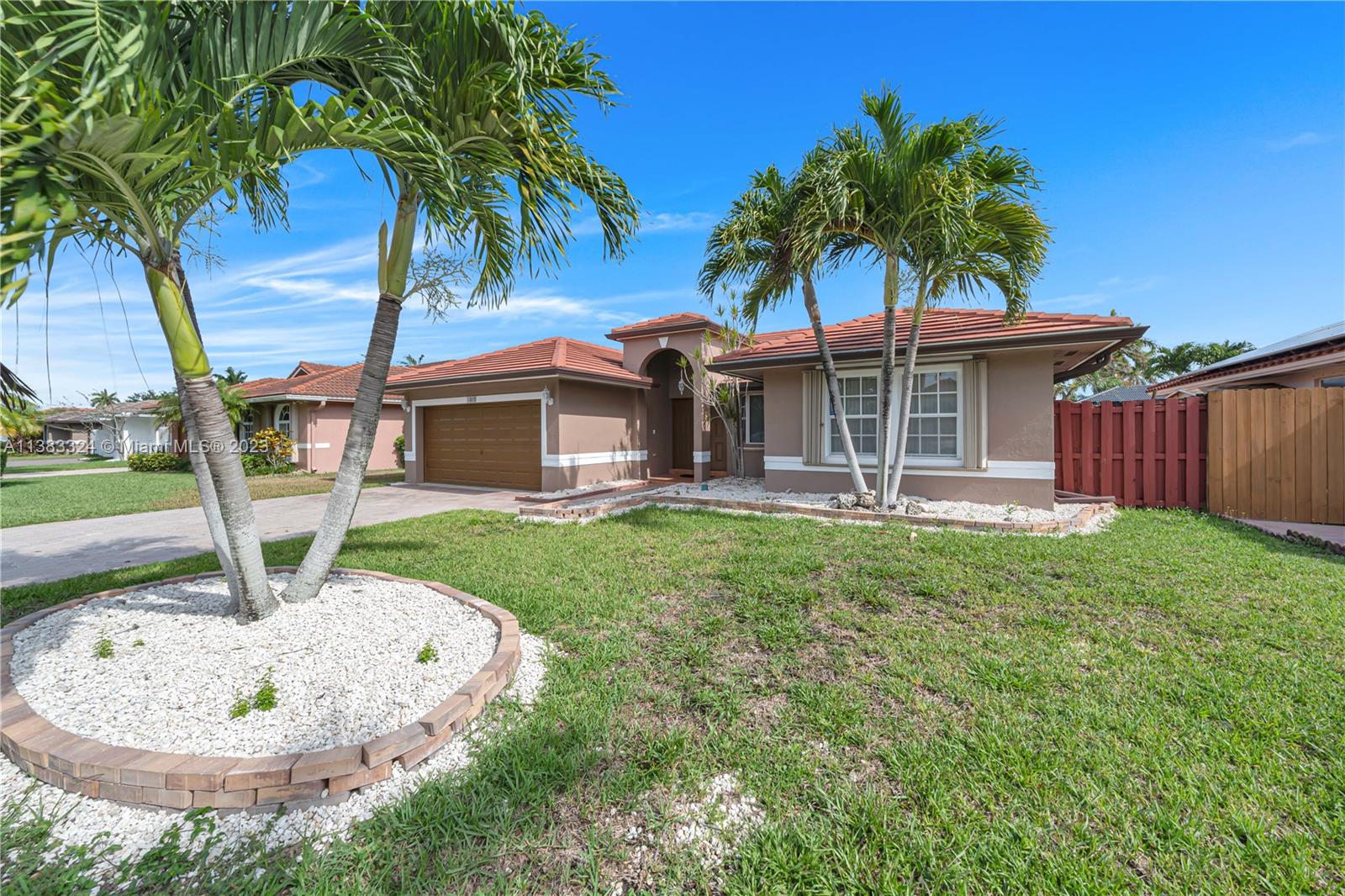 14809 Southwest 180th Street Miami, FL 33187 - Photo 4 of 38 a view of a house with a backyard