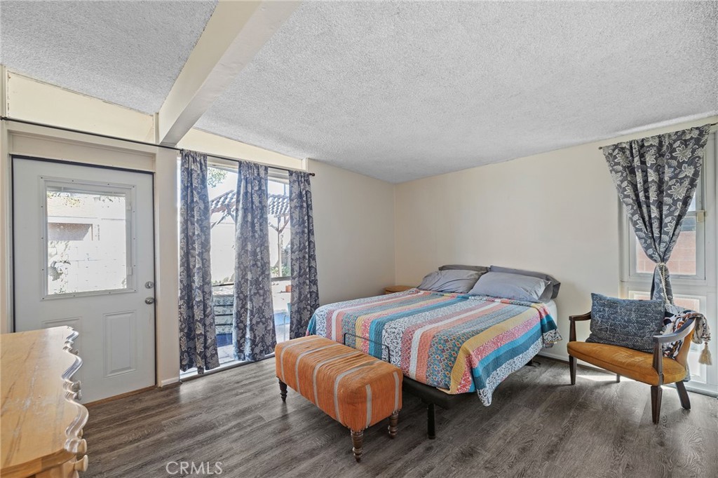 2273 West Judith Lane Anaheim, CA 92804 - Photo 11 of 13 a bedroom with a bed and wooden floor