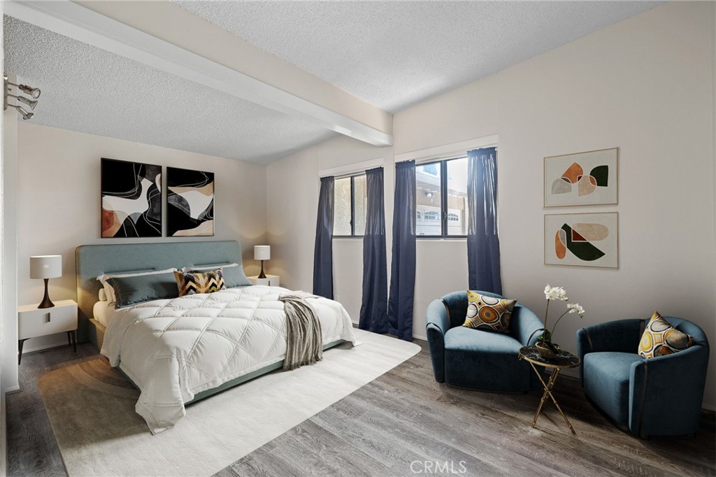 2273 West Judith Lane Anaheim, CA 92804 - Photo 7 of 13 a bedroom with a bed wooden floor and couch