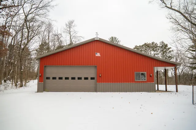 a view of a house with a wooden fence