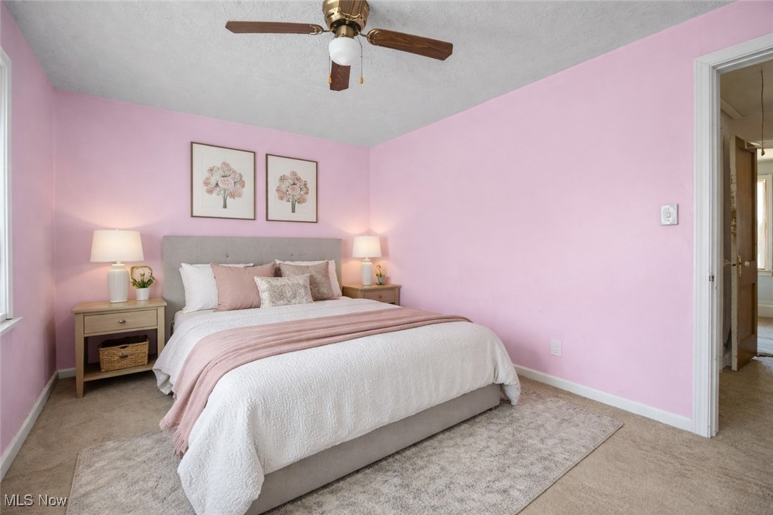 6927 North Wildacre Road Curtice, OH 43412 - Photo 9 of 44 Bedroom featuring carpet floors, ceiling fan, attic access, and a textured ceiling