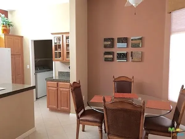 a view of a kitchen area with furniture and chandelier