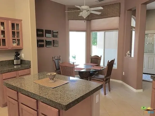a very nice looking dining room with chair and a window