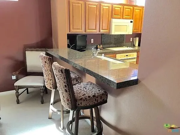 front view of a house with a garden