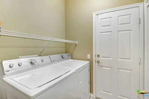 a view of a workspace with furniture